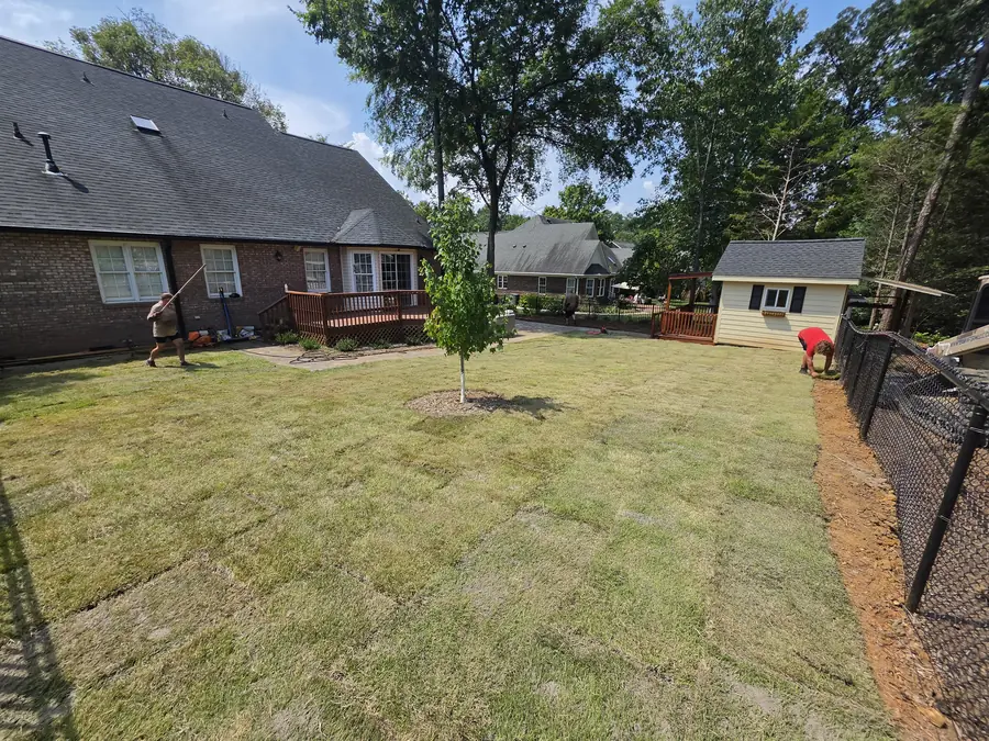 Paver patio connecting a main house to a guest cottage in Kannapolis, NC